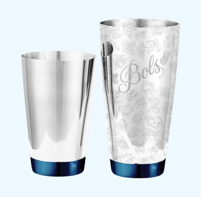A stainless steel cocktail shaker set with a matching metal tin and a tall patterned shaker cup. The cups have a dark blue metallic base and the tall cup is decorated with a light gray botanical pattern and the script name 'Bols'.