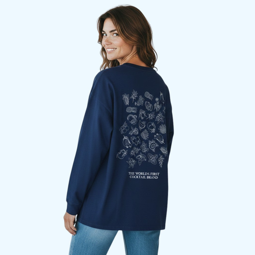 A woman wearing a navy blue long-sleeve t-shirt with a white graphic print on the back, shown from behind against a light blue background.