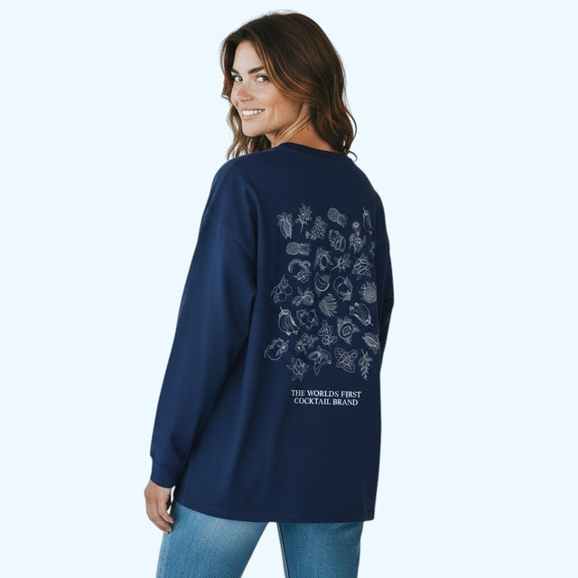 A woman wearing a navy blue long-sleeve t-shirt with a white graphic print on the back, shown from behind against a light blue background.