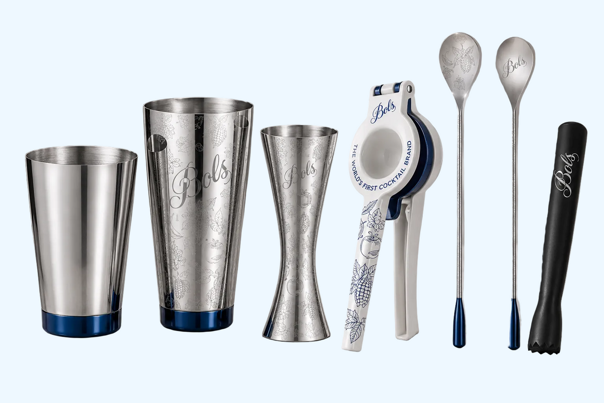 A set of personalized stainless steel cocktail and bar tools engraved with the name 'bols' and featuring blue accents, 