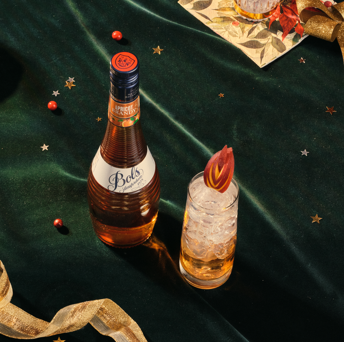 cocktail with bols apricot brandy liqueur in highball glass in festive setting