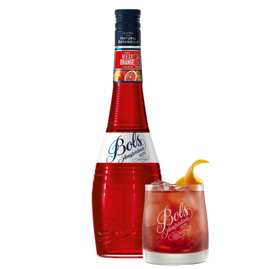 A bottle of Bols Red Orange liqueur next to a glass of cocktail, garnished with an orange slice.